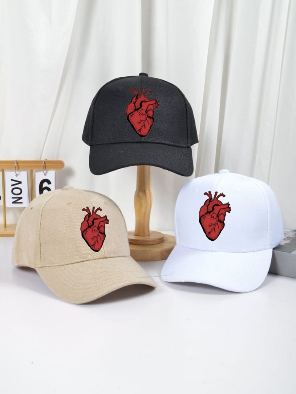 Heart Cap featuring a stylish heart graphic on the front. Made from soft, breathable fabric for all-day comfort, with an adjustable strap for a perfect fit. A cute and trendy accessory that adds a touch of love to any outfit.