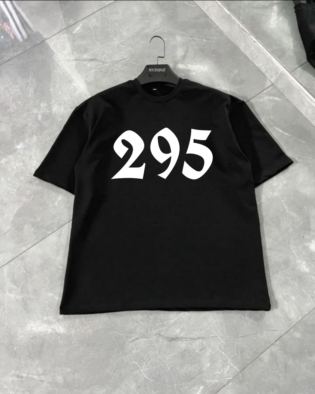 Graphic T-shirt featuring the iconic 'Sidhu 295' design, inspired by Sidhu Moosewala's impactful song '295.' The artwork combines bold typography with symbolic graphics that resonate with the song's themes, reflecting social awareness and cultural pride. The number '295' is prominently displayed, often in striking colors or distressed textures, creating a powerful, statement-making look. Made from soft, premium fabric for a comfortable fit, this tee is perfect for fans of Sidhu Moosewala