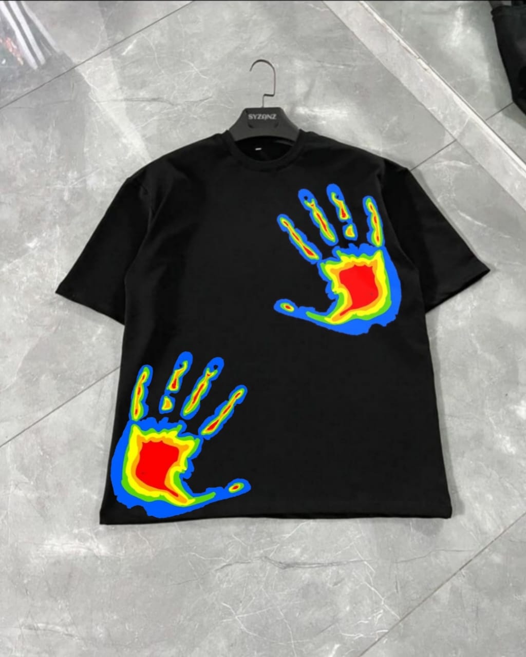 Graphic T-shirt featuring a vibrant 'Vivid Touch' design, showcasing multi-colored hands in a dynamic and artistic layout. The hands are printed in bold, bright colors, symbolizing diversity and creativity. The design captures a sense of energy and expression, making it a unique and eye-catching piece. Made from soft, comfortable fabric, this T-shirt is perfect for those who appreciate colorful, meaningful fashion that stands out.